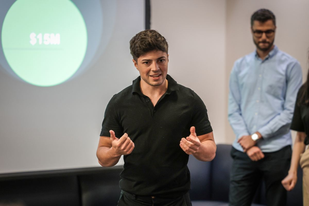 Man giving a presentation, representing when to pivot or persevere.