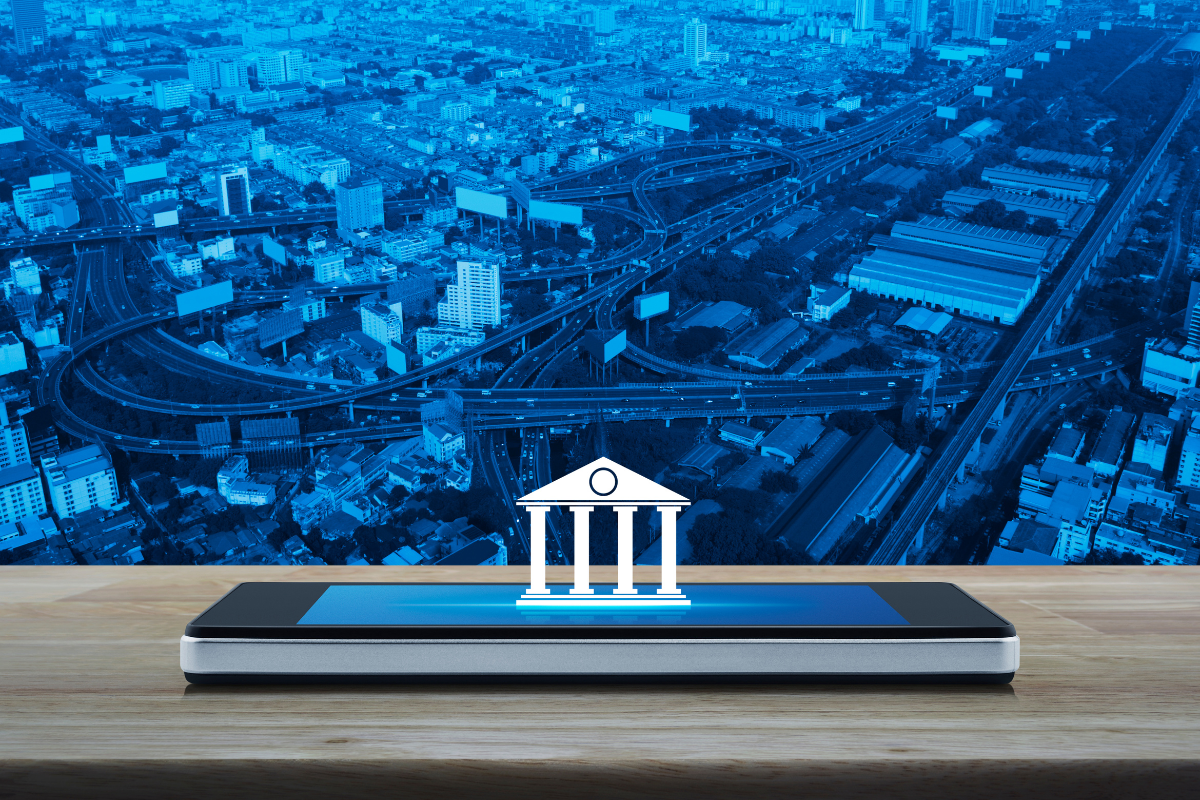 The image shows a bank icon on a smartphone, symbolizing neobanks.