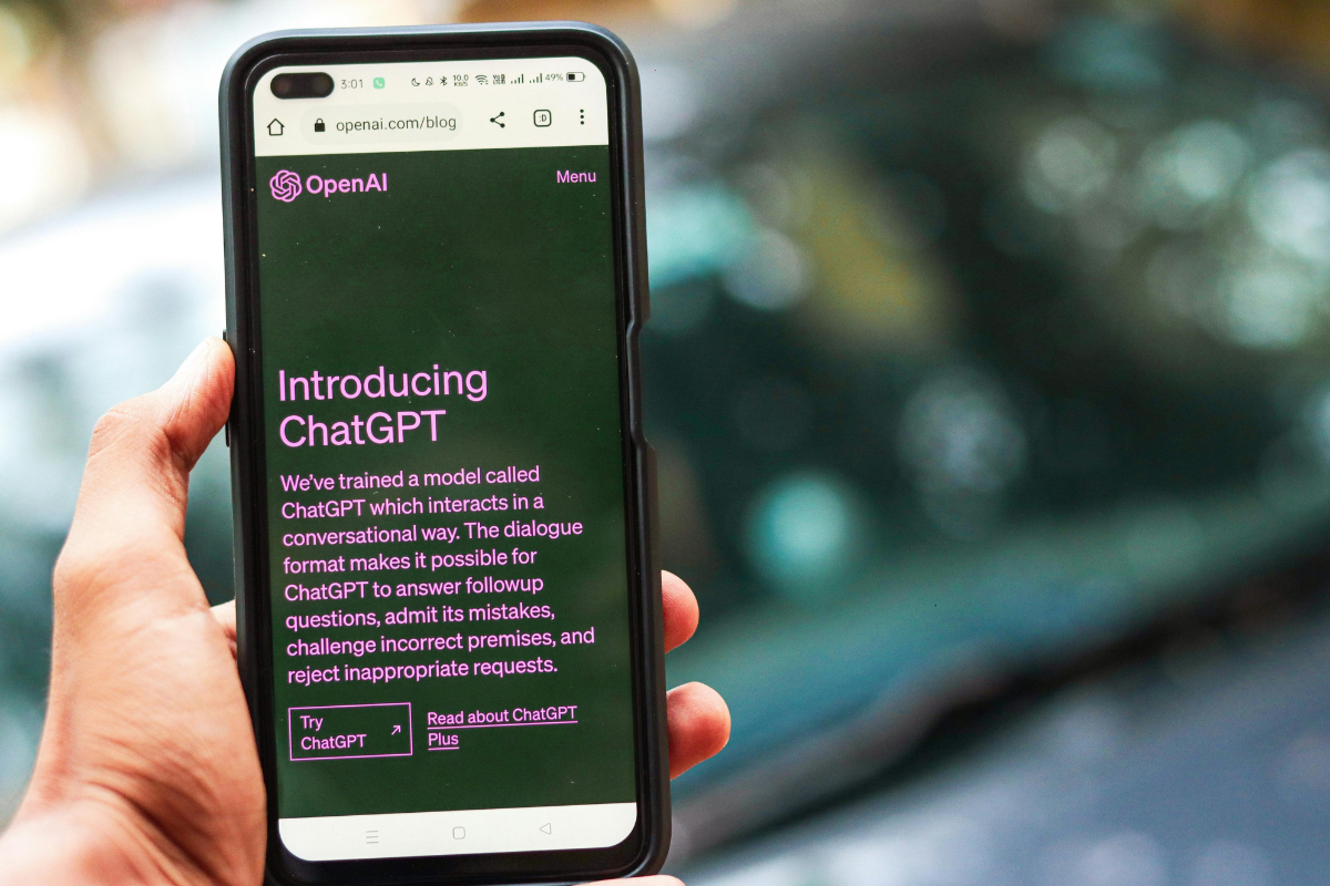 The image shows a cell phone with a welcome message for ChatGPT, symbolizing one of the historic moments that made Silicon Valley what it is today.