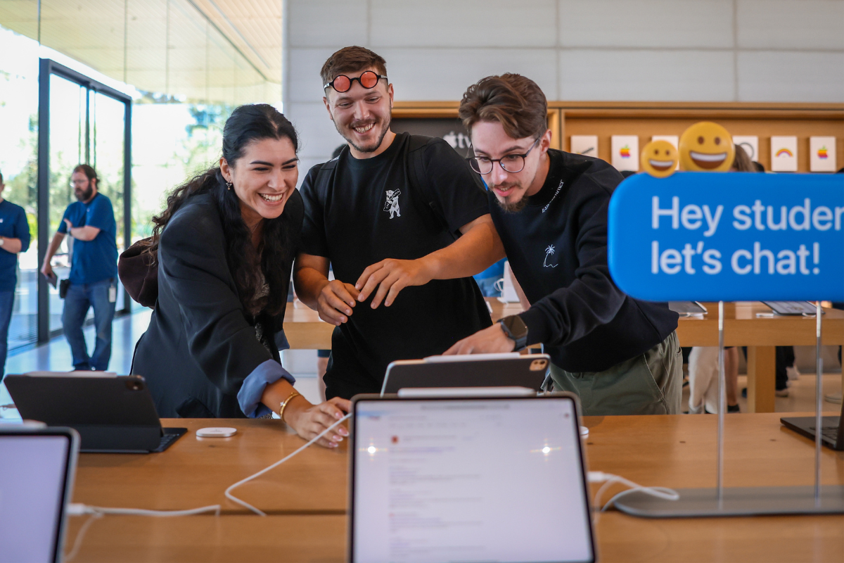 The image shows three ABC Silicon Valley 2025 participants during a visit to the Apple Park Visitor Center.