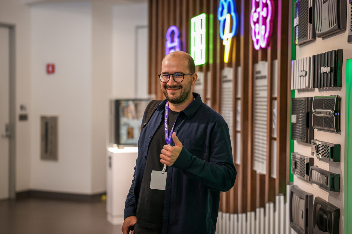 The image shows Luis, a participant at ABC Silicon Valley 2025, during a visit to NetApp.
