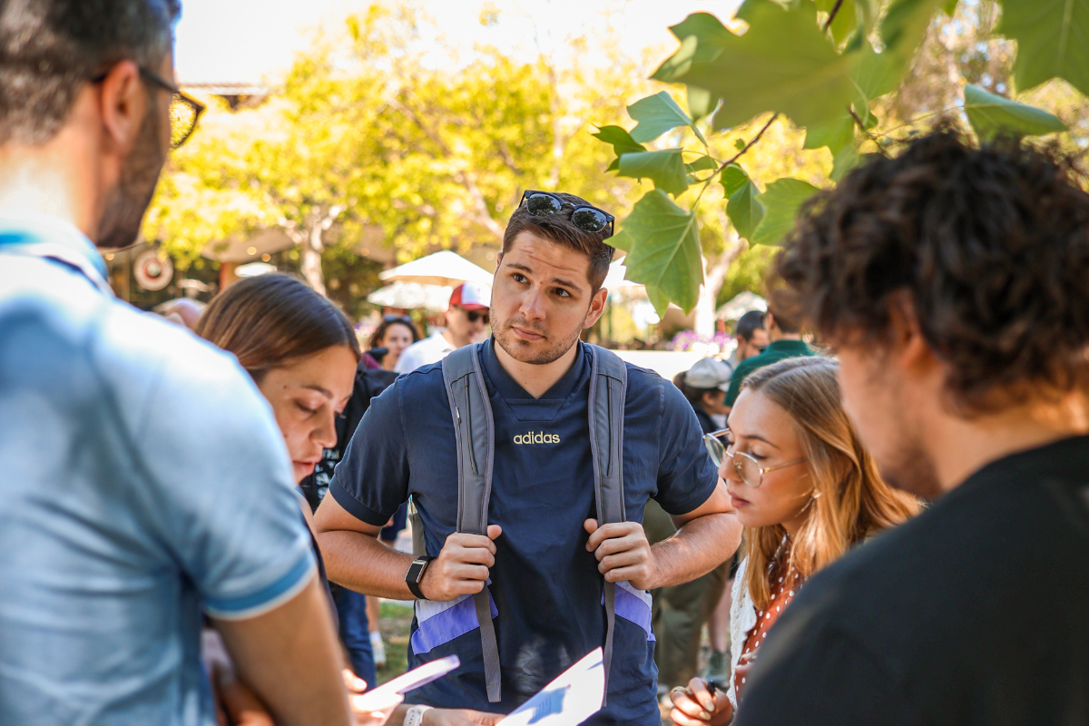 The picture shows Jonas with several participants working on solving tasks for Stanford University's Photo Hunt.