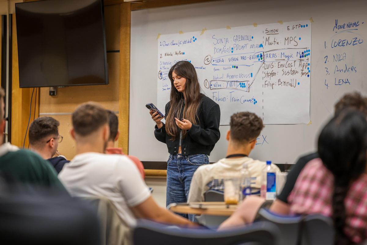 The picture shows Lena, one of the participants of ABC Silicon Valley 2025, during a presentation in front of a group of other participants.